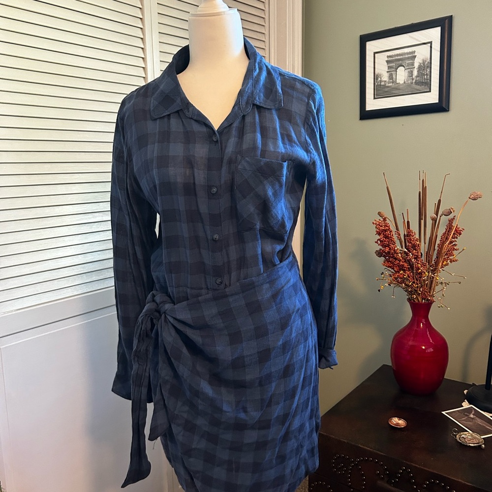 Very cute blue checked shirt with apron in front.